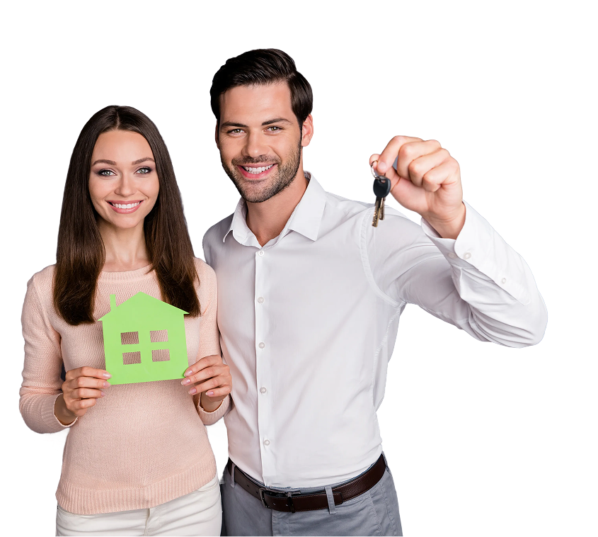 Couple happily showing house keys in front of their new home